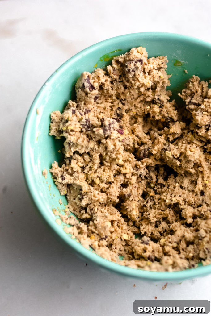 Smooth and ready cookie dough in a mixing bowl, awaiting shaping.