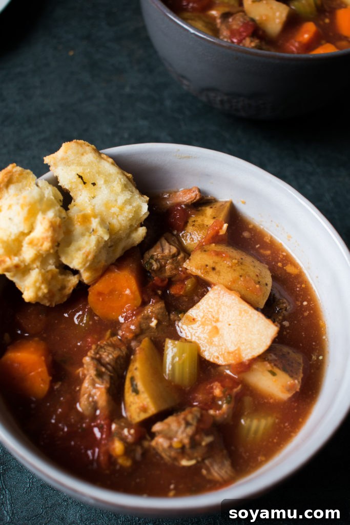 A large pot of slow cooker vegetable beef soup, ready for serving or meal prepping.