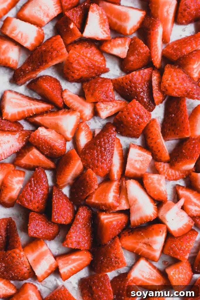 Strawberry Bacon Summer Salad with Poppyseed Perfection 3 Close-up of freshly sliced strawberries, ready for a summer salad.