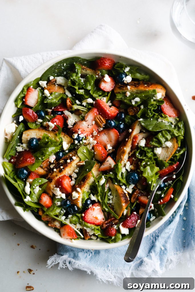 Strawberry Bacon Summer Salad with Poppyseed Perfection 6 A beautifully assembled Strawberry Summer Salad with Grilled Chicken, Bacon, and Poppyseed Dressing in a bowl, ready to be served.