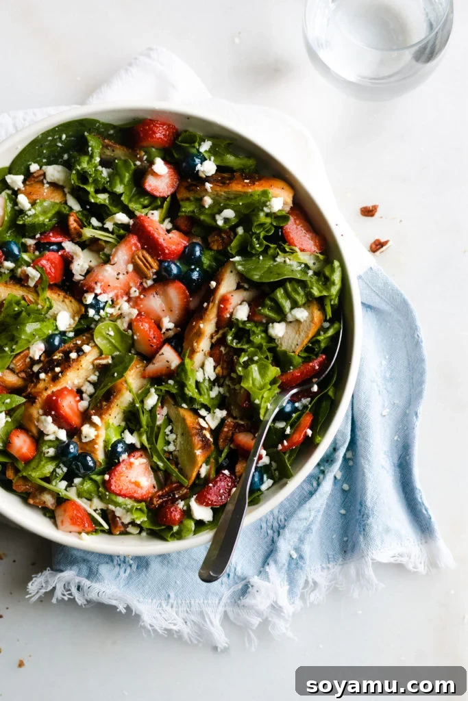 Strawberry Bacon Summer Salad with Poppyseed Perfection 8 Strawberry Summer Salad presented in a bowl, ready to be enjoyed on a sunny day.