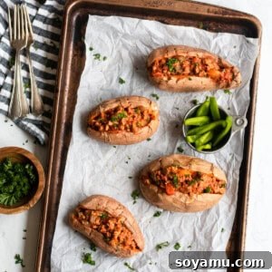 Nourishing Homemade Sloppy Joes 8 Sloppy joes served in roasted sweet potatoes, garnished with fresh herbs.