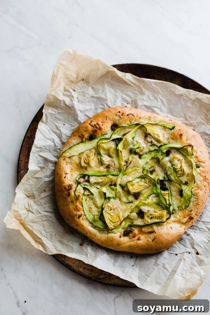 Hot and Ready Green Goddess Pizza Freshly baked green goddess pizza, golden brown with melted cheese and vibrant toppings.
