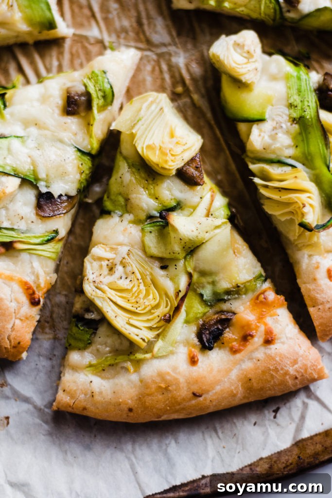 Serving Platter of Green Goddess Pizza Multiple slices of green goddess pizza arranged on a wooden board, ready to be served.