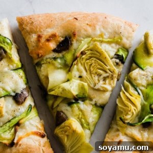 Verdant Goddess Pie 2 Recipe image: Close-up of a slice of green goddess pizza.
