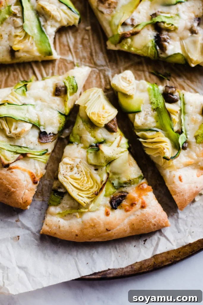 Delicious Vegetarian Pizza - Green Goddess Green Goddess Pizza, showing a full view of the baked pizza with vibrant green toppings.