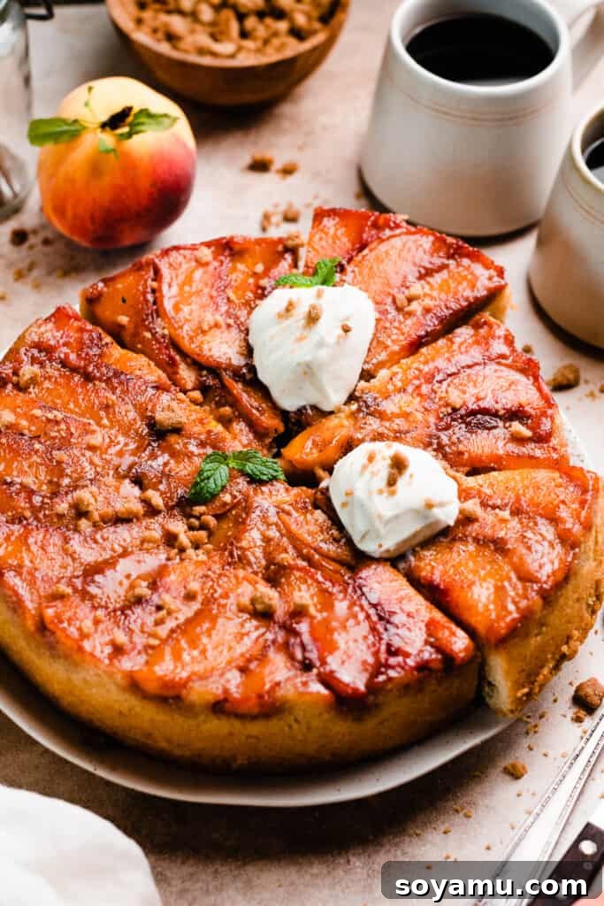 Caramelized Peach Cobbler Flip 13 The full peach cake, sliced, on a cake plate.