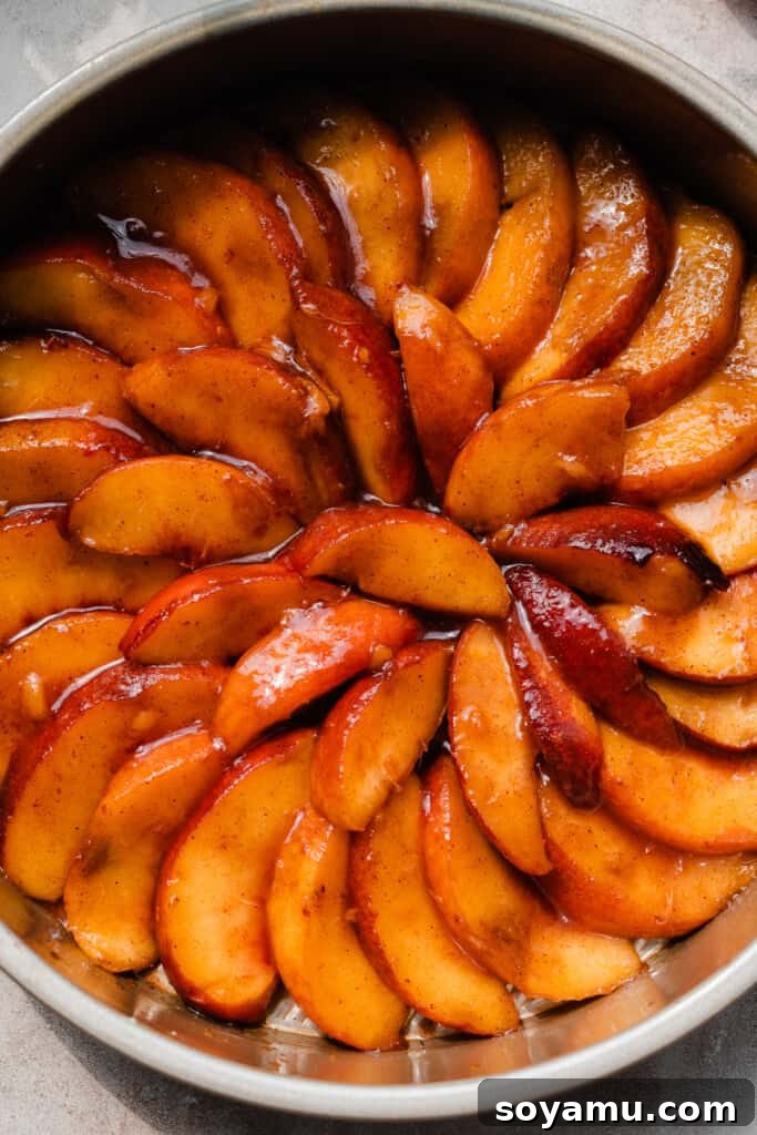 Caramelized Peach Cobbler Flip 8 A close-up of the spirals of peach slices in the cake pan.