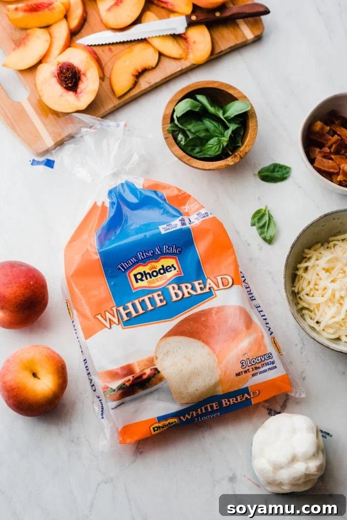 Freshly sliced peaches and a package of Rhodes white bread dough, ready for pizza preparation.