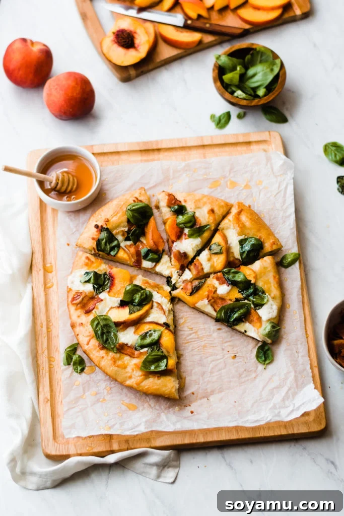 A final image of the beautifully sliced peach pizza on a wooden cutting board.