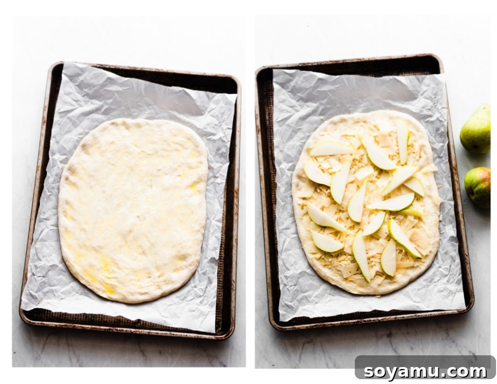 Assembling Pear Pizza with Cheese and Pears Pizza dough laid out on a baking sheet with sage olive oil, cheese, and pear slices as initial toppings.