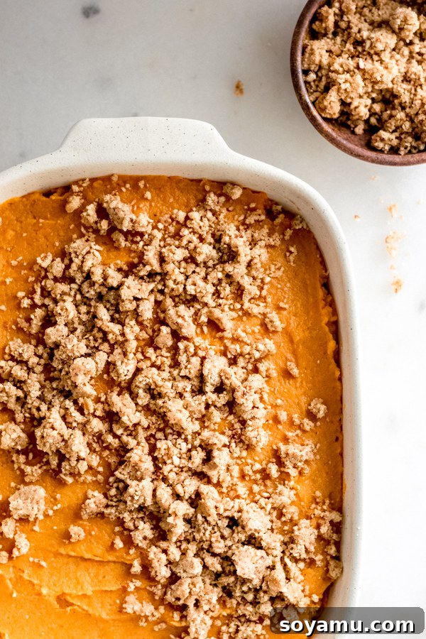 Sweet Potato Casserole with Brown Sugar Pecan Topping A rich sweet potato casserole baked to perfection, topped with a golden brown sugar pecan streusel, ideal for Thanksgiving or any fall gathering.