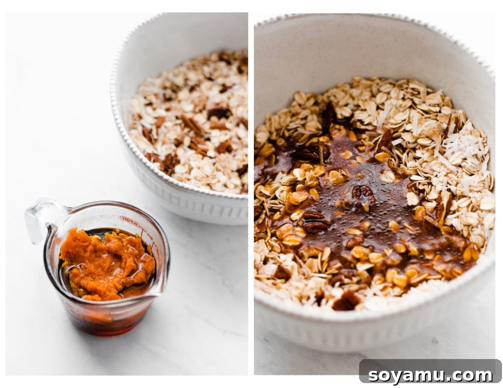 A large baking sheet filled with unbaked pumpkin granola mixture, evenly spread.