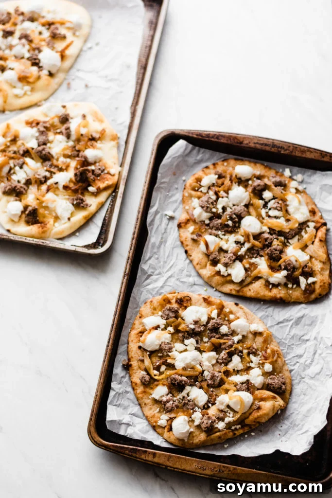 Plated grilled lamb pizza slices topped with fresh arugula and a honey drizzle