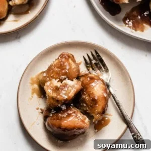 Effortless Apple Cider Caramel Monkey Bread 2 A close-up of the finished Caramel Apple Cider Monkey Bread, showcasing its inviting texture and rich caramel drizzle.