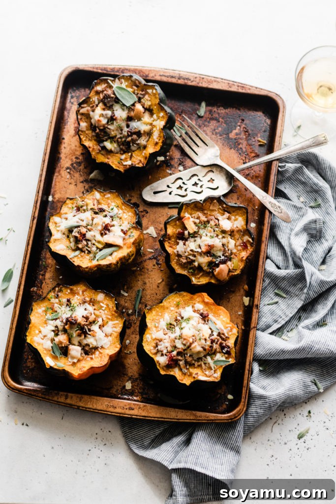 Harvest Feast: Stuffed Acorn Squash with Wild Rice, Lamb, and Autumn Fruits, Baked to Golden Perfection. A baking pan filled with golden-brown halves of stuffed acorn squash, freshly out of the oven, with steam gently rising.