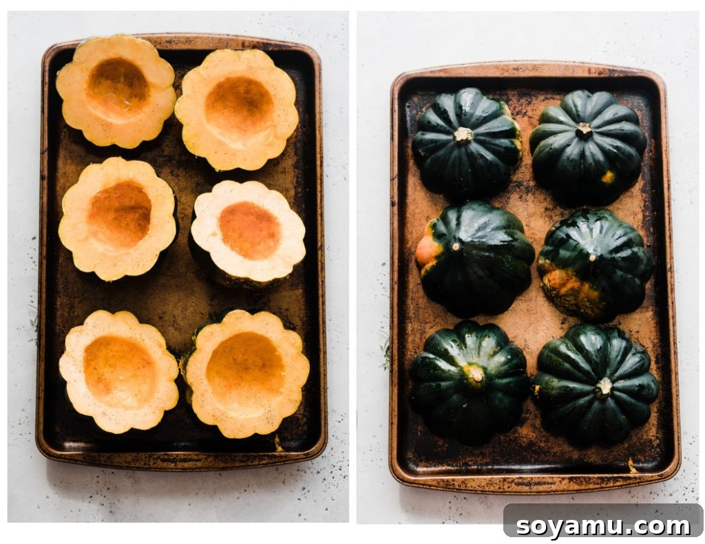 Preparation for Roasting: Seasoned Acorn Squash Halves on a Baking Sheet. Acorn squash halves, seasoned with olive oil, salt, and pepper, are placed cut-side down on a baking sheet, ready for roasting.