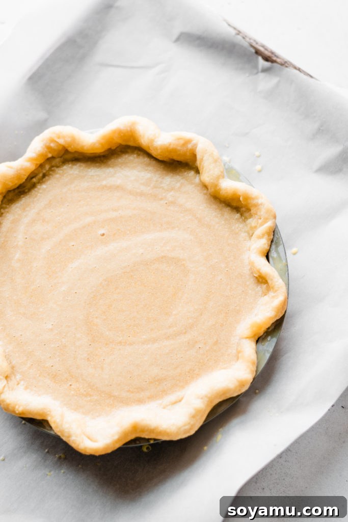 Creamy maple filling and flaky crust of the Brûléed Maple Pie Close-up of the creamy maple pie filling with a golden-brown crust, showcasing its smooth texture