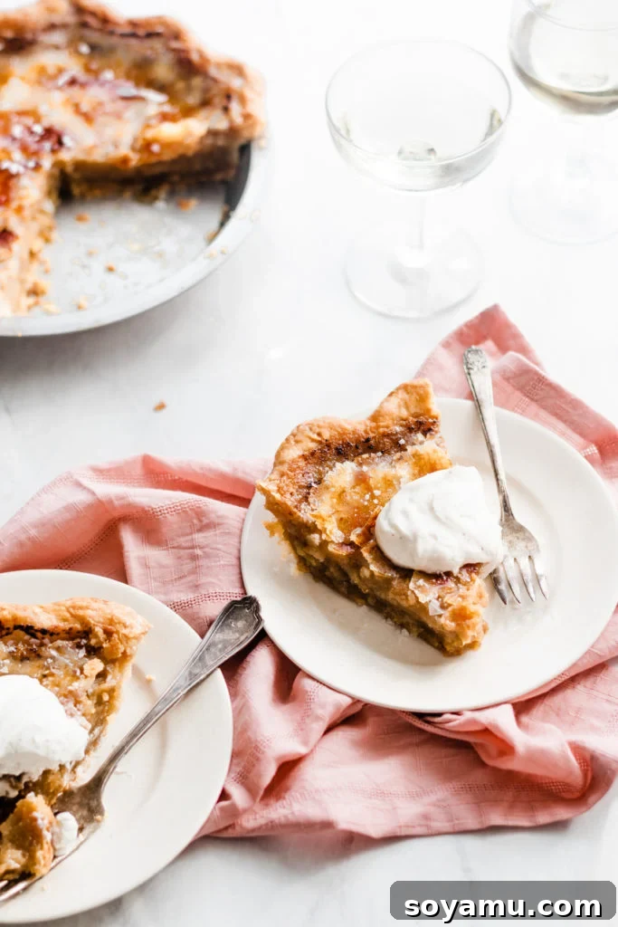 Perfect slice of Brûléed Maple Pie with a visible flaky crust A slice of Brûléed Maple Pie showing the distinct layers of crisp topping, creamy filling, and flaky crust