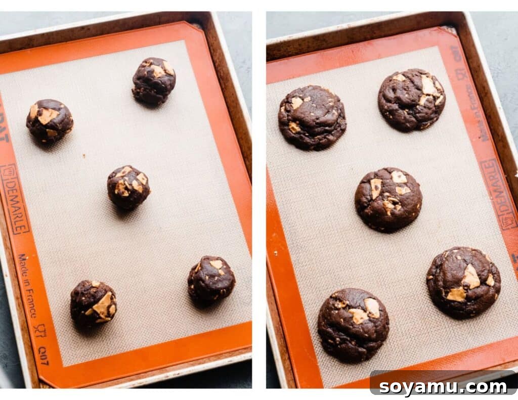 Double Chocolate Caramelized White Chocolate Cookies 8 A baking sheet featuring both unbaked cookie dough balls and a tray of freshly baked, golden-edged chocolate white chocolate chip cookies.