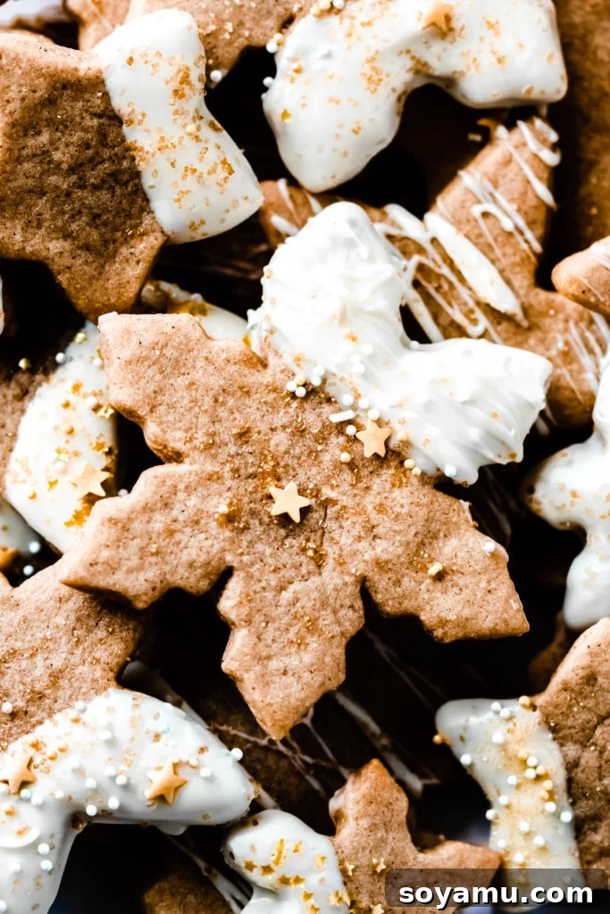 Cinnamon Spiced Maple Cutout Cookies: Soft, Maple-Flavored & Perfectly Spiced for Holidays Delicious Cinnamon Spiced Maple Cutout Cookies dipped in white chocolate and garnished with gold sprinkles, perfect for holiday gatherings and Christmas baking.