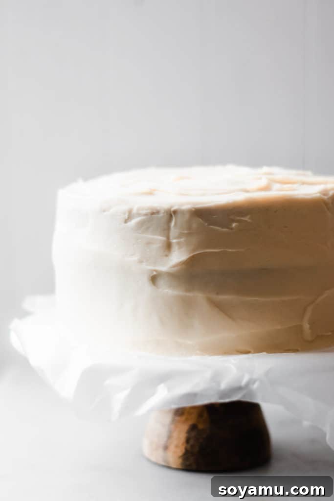 Smoothing frosting for a perfect finish Applying a crumb coat to the cake