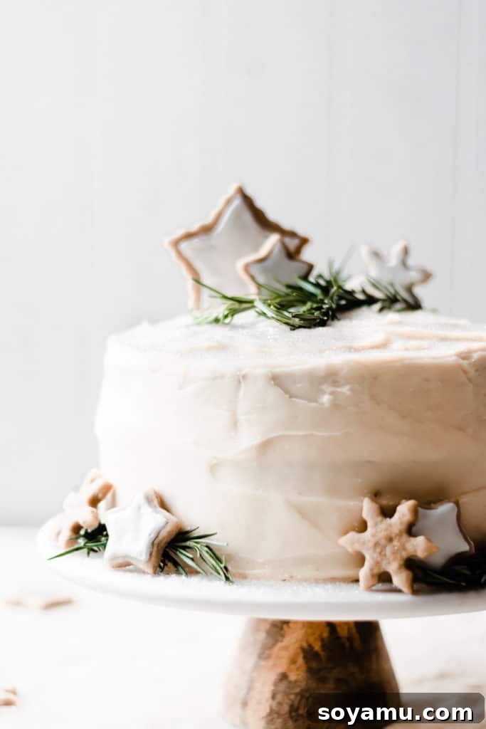 Beautifully decorated Winter Wonderland Cake with festive elements Caramelized White Chocolate Winter Wonderland Cake ready for serving