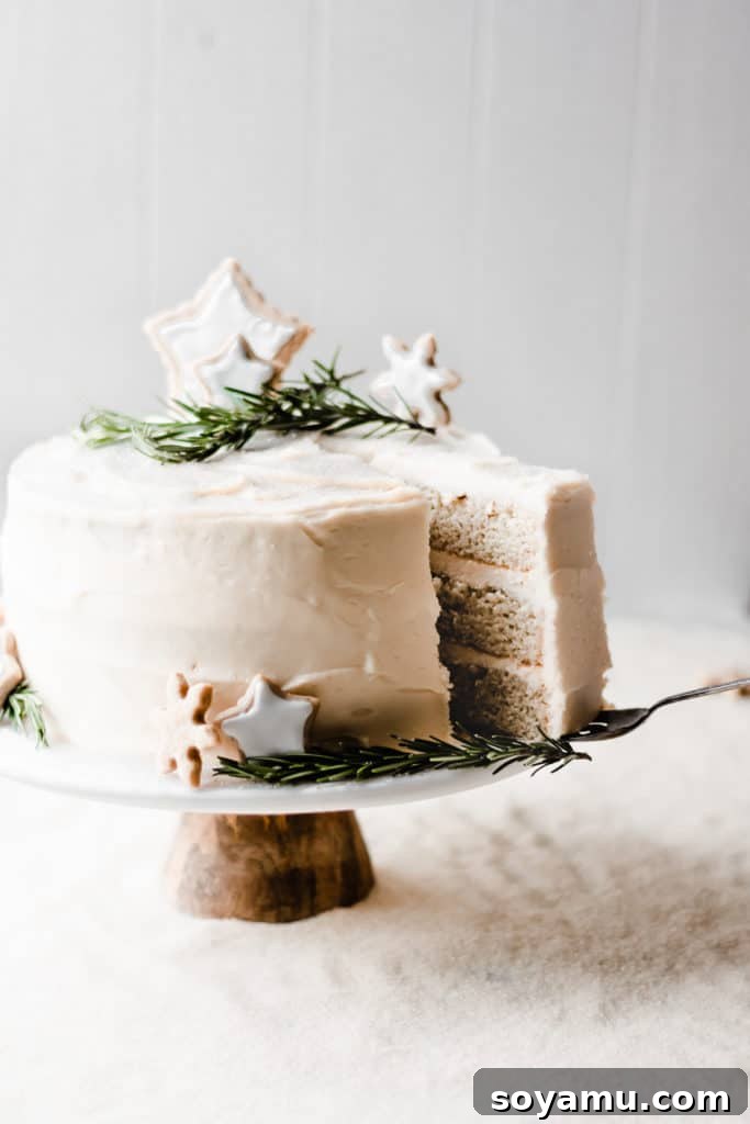 Holiday cake with snowflake cookies and rosemary Detailed shot of the cake's festive decor