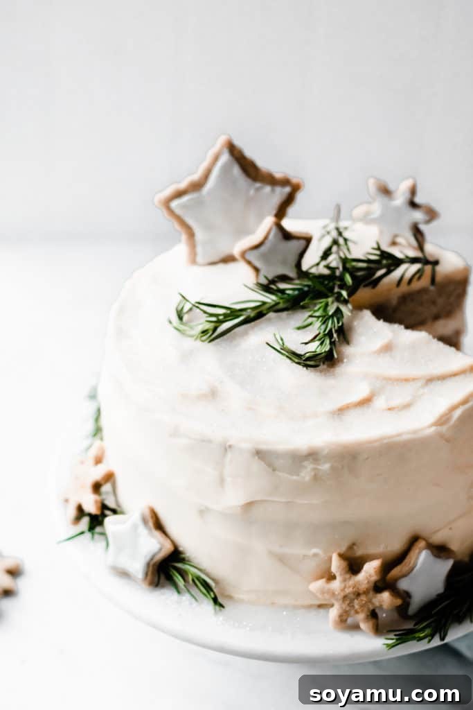 Caramelized White Chocolate Winter Wonderland Cake adorned with cookies and sugar Close-up of the elegant Caramelized White Chocolate Winter Wonderland Cake