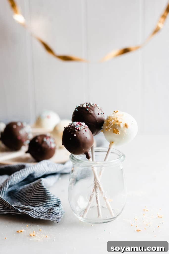 The perfect chocolate choices for flawlessly coated cake pops A vibrant assortment of chocolate cake pops dipped in various chocolates: white, milk, and semi-sweet.