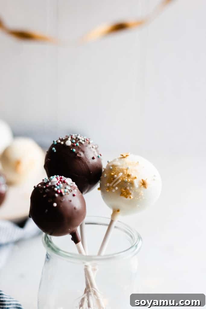 Birthday celebration cake pops with sprinkles Festive chocolate cake pops decorated with colorful sprinkles for a birthday celebration.