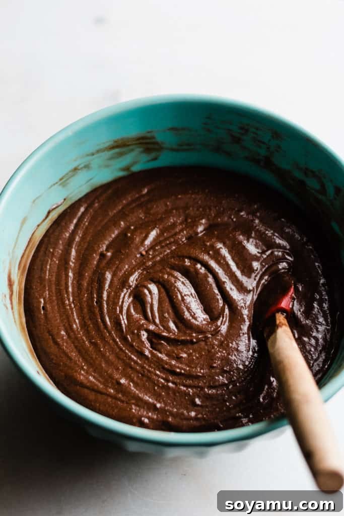 The first step: baking a rich chocolate cake for cake pops Preparing the base: freshly baked chocolate cake, crumbly and ready for mixing into cake pop dough.