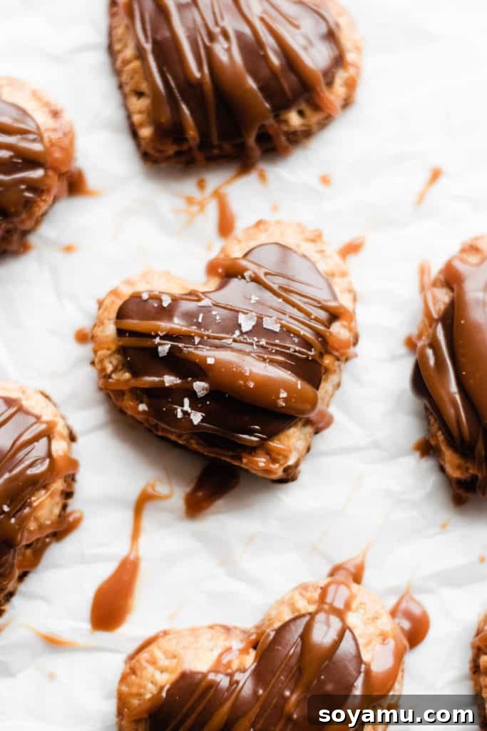 Homemade Nutella Pop Tarts Heart-shaped homemade Nutella Pop Tarts, glazed and drizzled with salted caramel, perfect for Valentine's Day.
