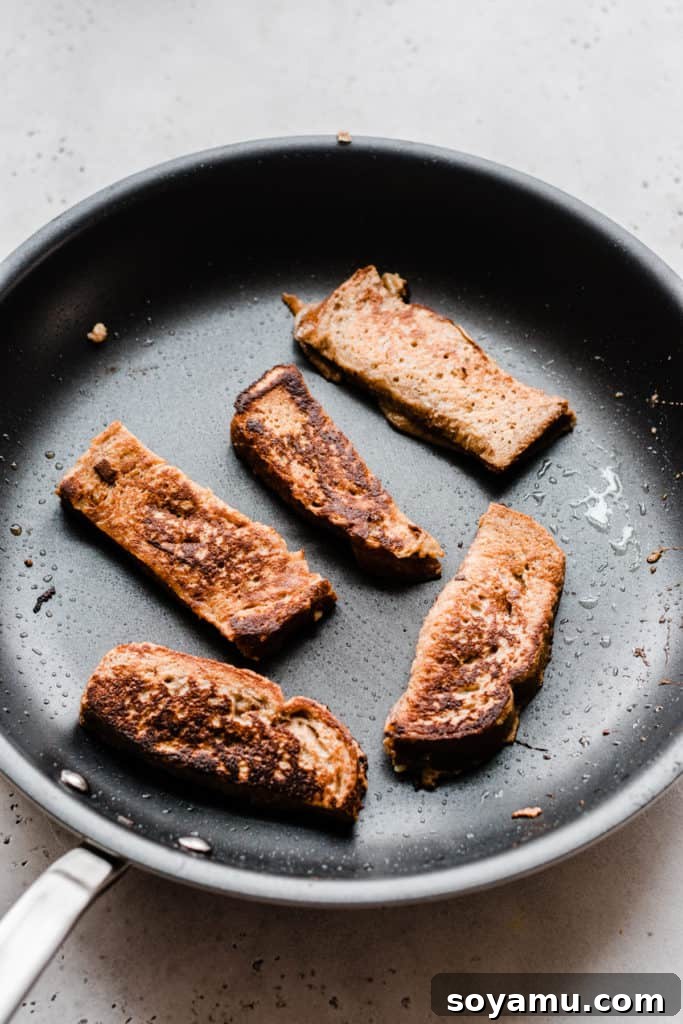 Freshly cooked Churro French Toast Sticks in the pan Crispy french toast sticks finished in pan