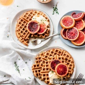 A close-up of a buttermilk waffle with roasted blood oranges and honey mascarpone
