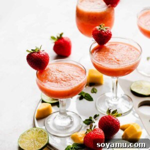 Frozen Coconut Rum Punch with Strawberry, Mango, and Lime