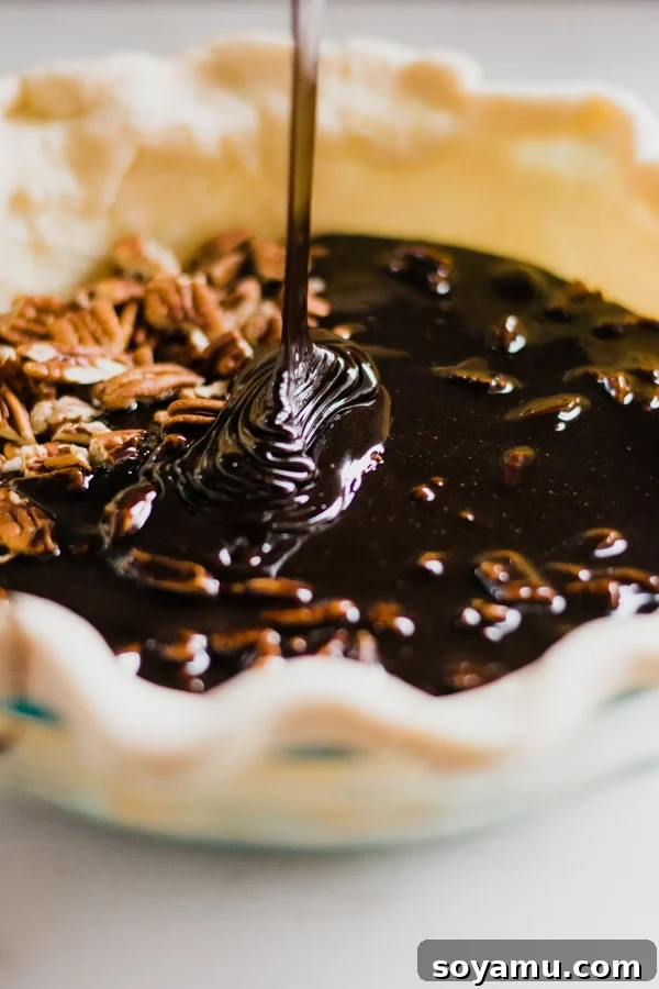 The Easiest 3-Ingredient Pie Crust Ever 16 Chocolate pecan pie filling in a homemade pie crust.
