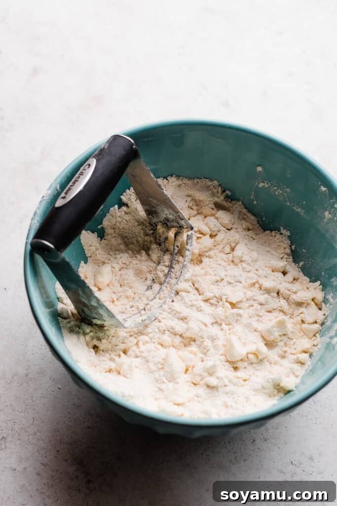 The Easiest 3-Ingredient Pie Crust Ever 6 Butter being cut into the dry mixture.