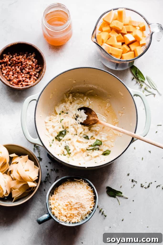 Velvet Butternut Pasta with Savory Pancetta 4 A vibrant flat lay shows various ingredients for butternut squash pasta: bowls of cooked pasta, grated cheeses, and crispy pancetta, all arranged around a Dutch oven where onions and fresh herbs are gently sautéing in rendered pancetta fat.
