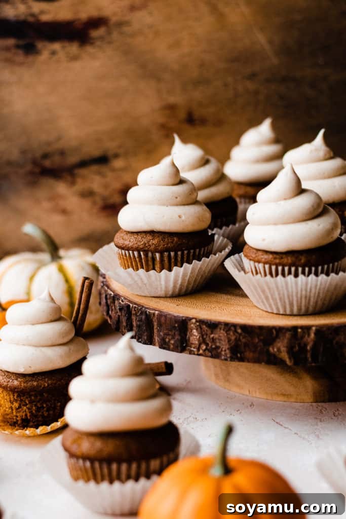 Autumn Pumpkin Delights with Brown Butter Cream Cheese 10 Frosted cupcakes on a rustic wooden cake stand