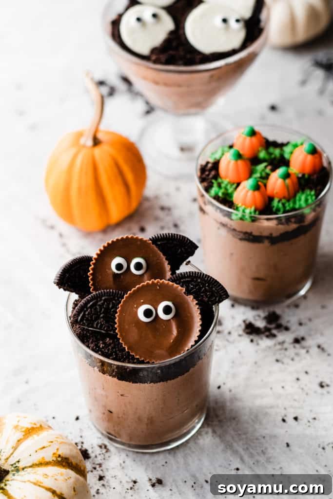 A dirt cup topped with peanut butter cup bats