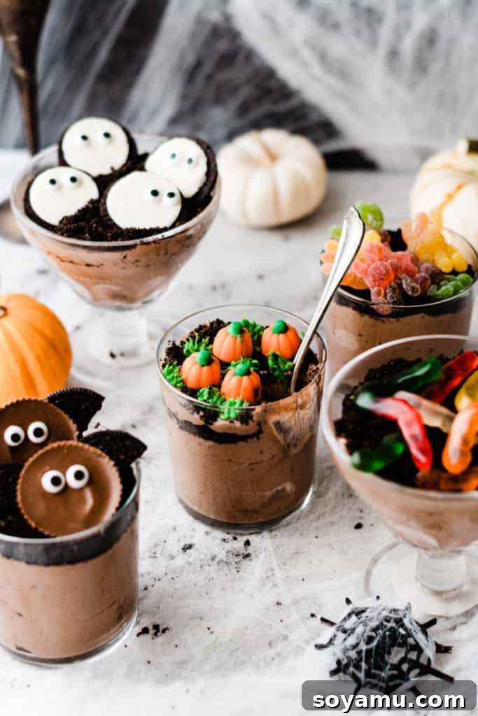 A dirt cup with a spoon taking a bite out
