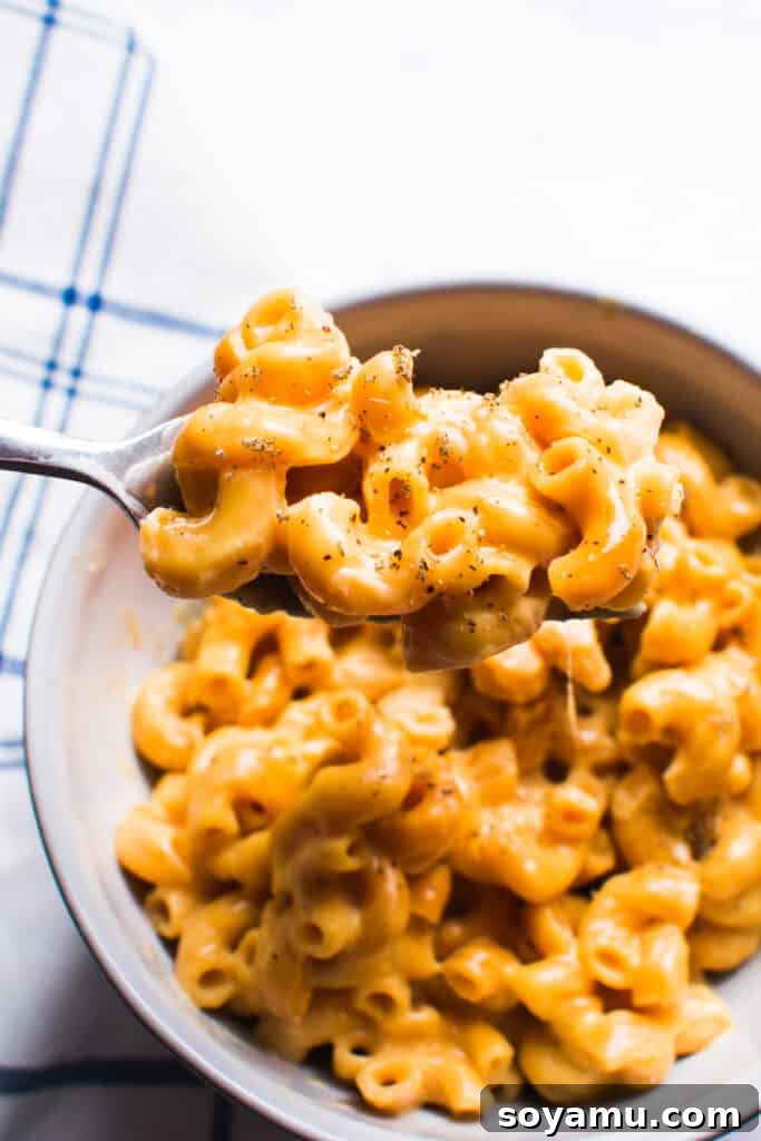 Gourmet Instant Pot Mac and Cheese with Sage A bowl of creamy Instant Pot Mac and Cheese garnished with fresh sage.
