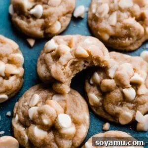 White chocolate macadamia nut cookies on a blue background.