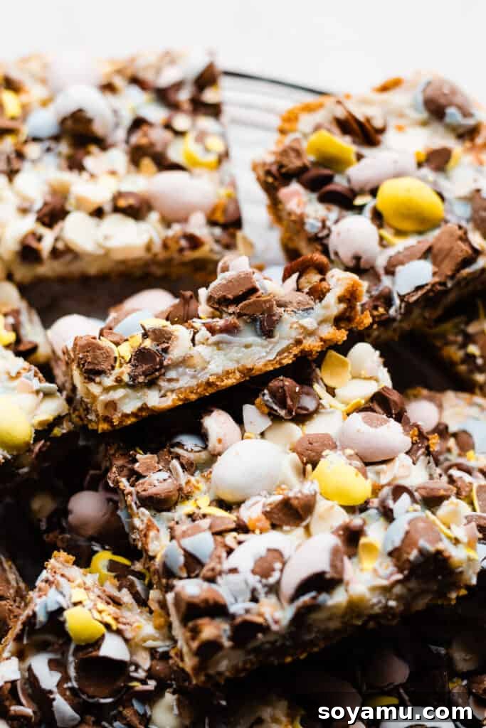 Seven Layer Bars arranged neatly on a cooling rack, showcasing their delicious layers and Easter candy topping.