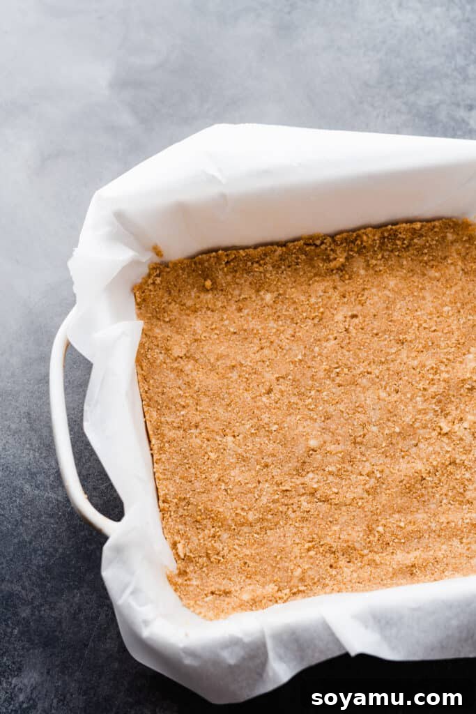 Tropical Key Lime Macadamia Bars 4 The crust pressed into a 9x9 pan.