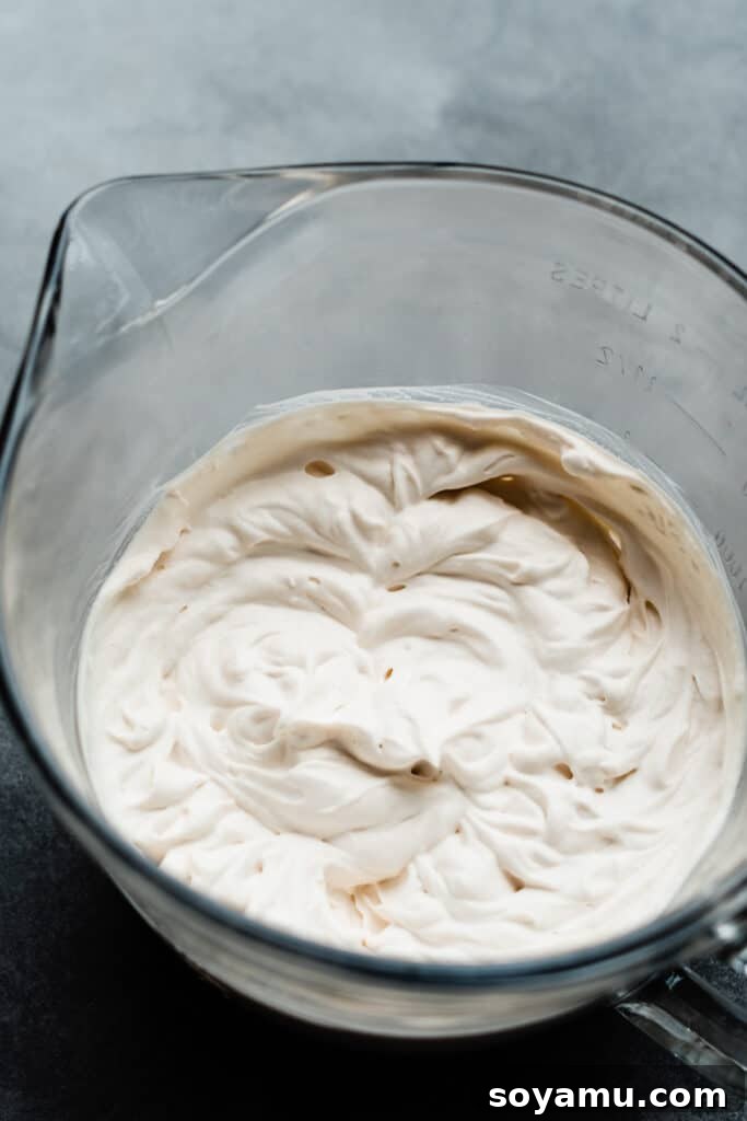 Tropical Key Lime Macadamia Bars 7 A bowl of whipped cream.