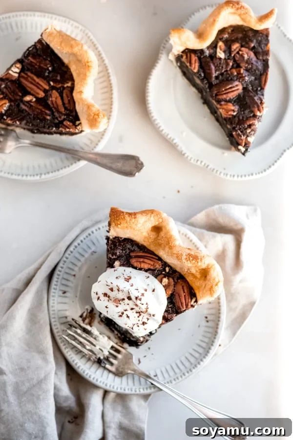 Delicious Slices of Chocolate Bourbon Pecan Pie Slices of chocolate bourbon pecan pie on plates.