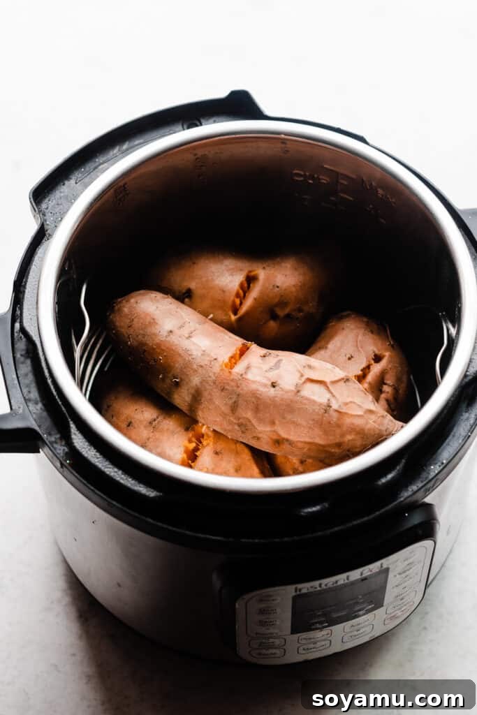 Candied Sweet Potato Casserole with Pecan Streusel 4 Cooked sweet potatoes in an instant pot, ready to be peeled.