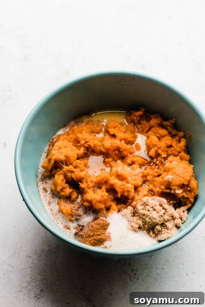 Candied Sweet Potato Casserole with Pecan Streusel 5 A bowl of the sweet potato filling ingredients, mashed and ready for baking.